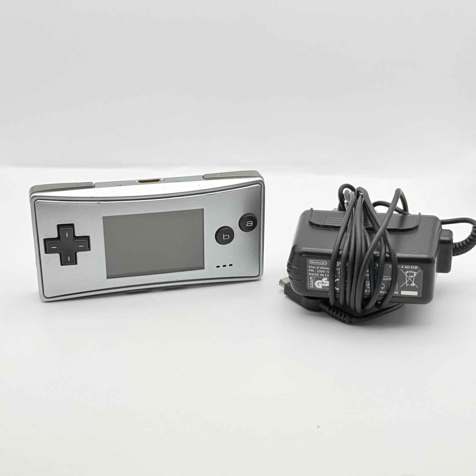 NINTENDO GAME BOY MICRO GRIGIO- 100% FUNZIONANTE + CARICATORE ORIGINALE NINTENDO
